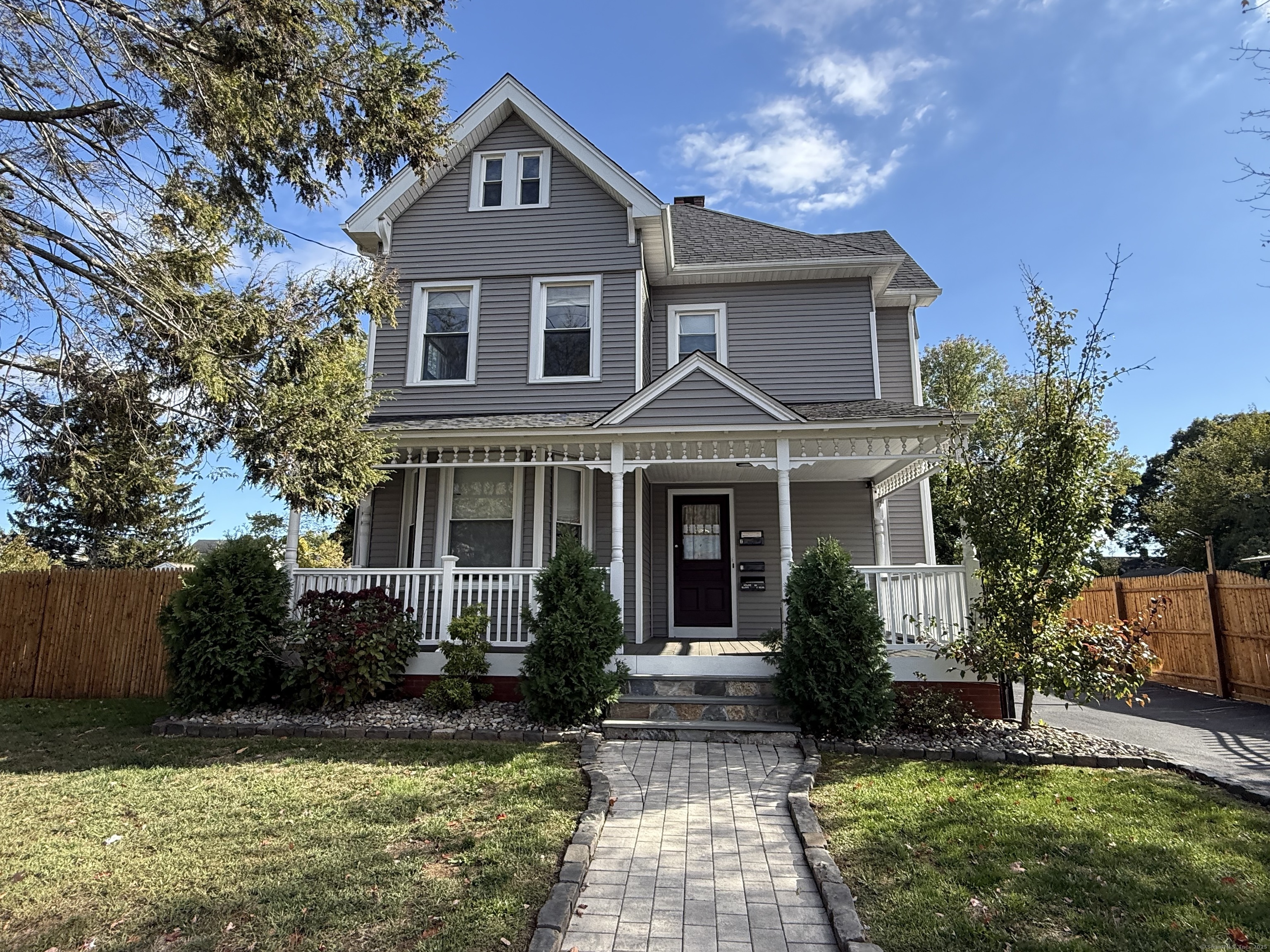 128 Spring Street West Haven, CT 06516 - Photo 1 of 23 a front view of a house with garden