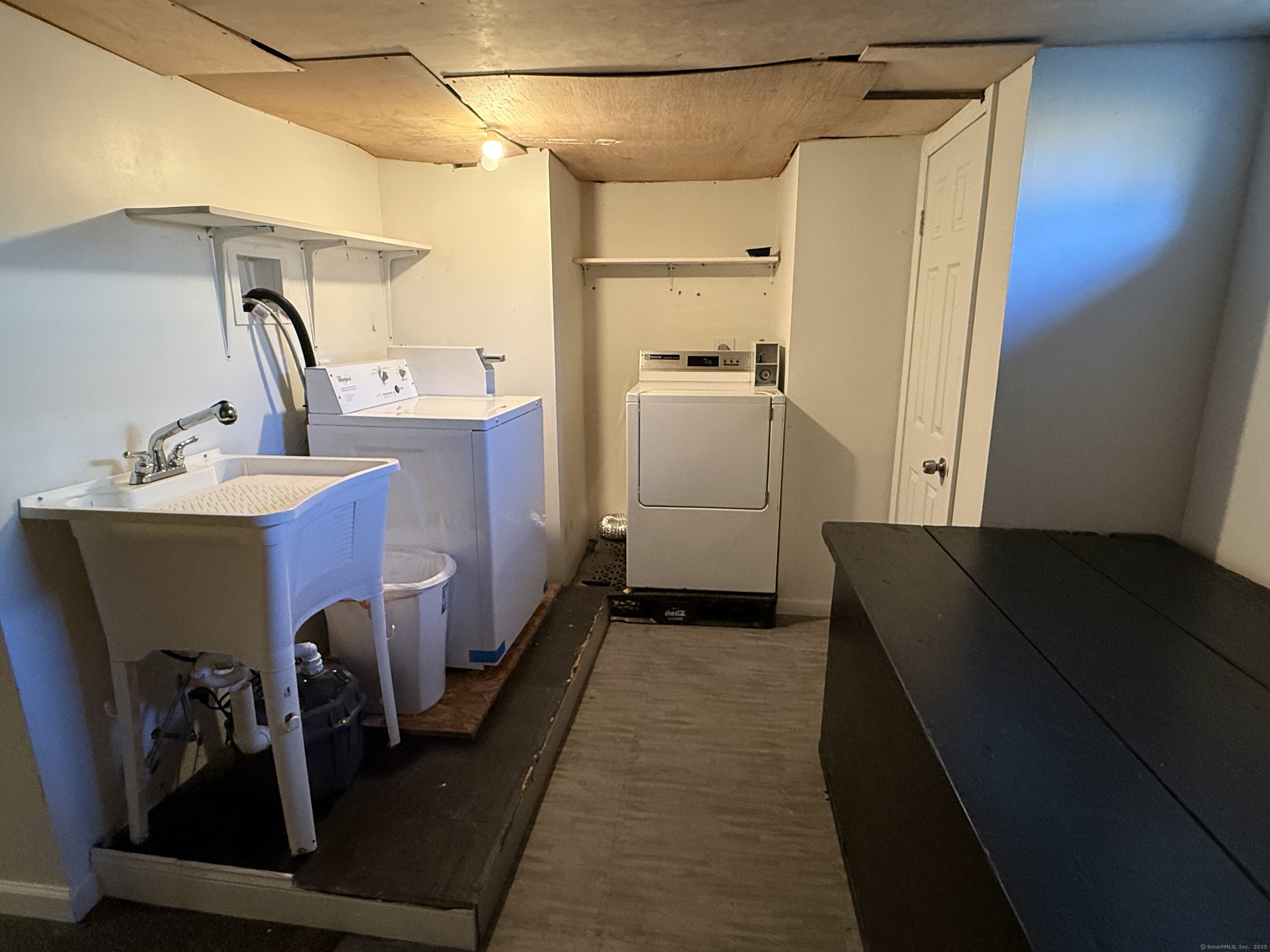 128 Spring Street West Haven, CT 06516 - Photo 21 of 23 a room with storage and utility