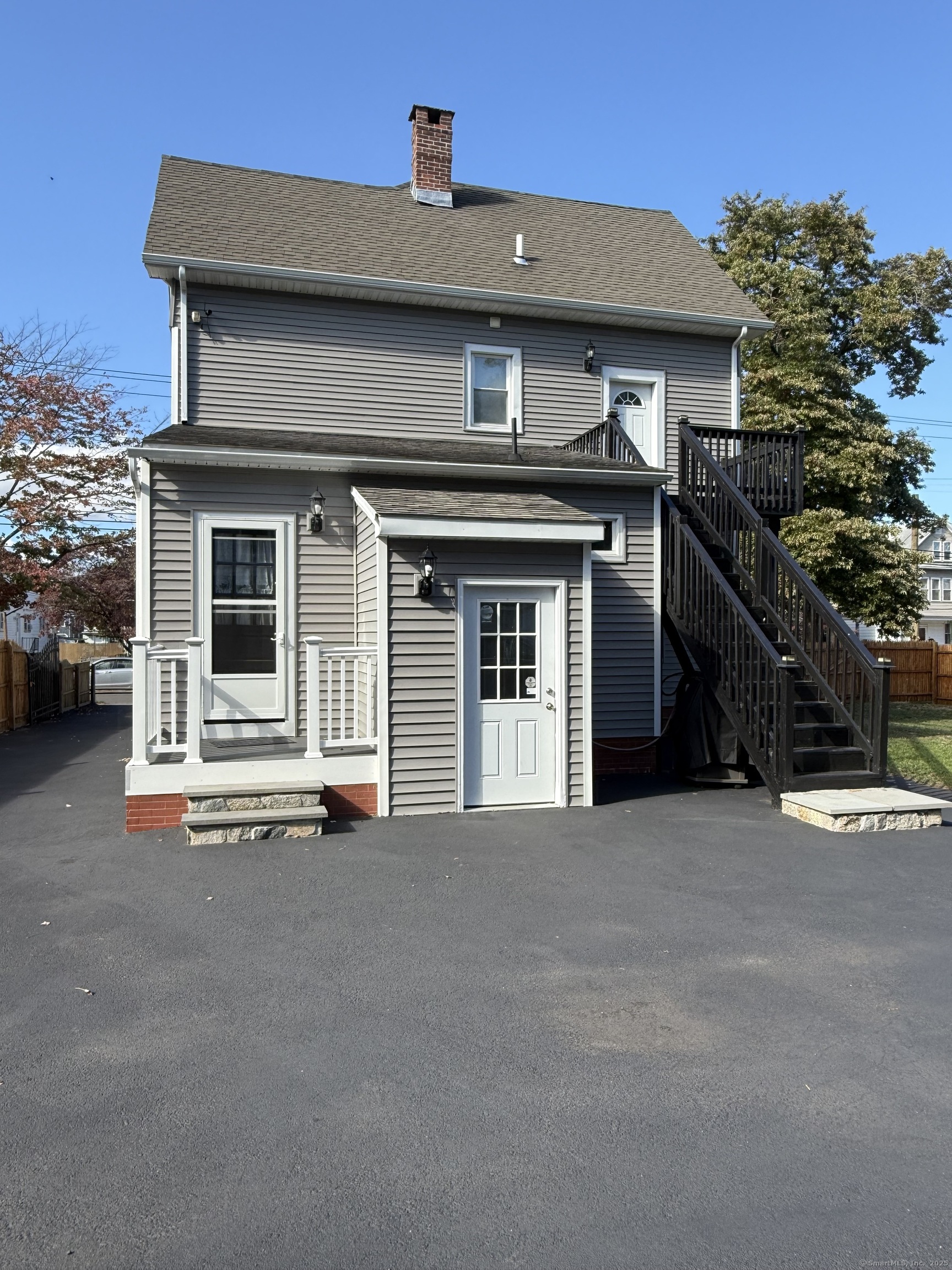 128 Spring Street West Haven, CT 06516 - Photo 22 of 23 a front view of a house with a garage