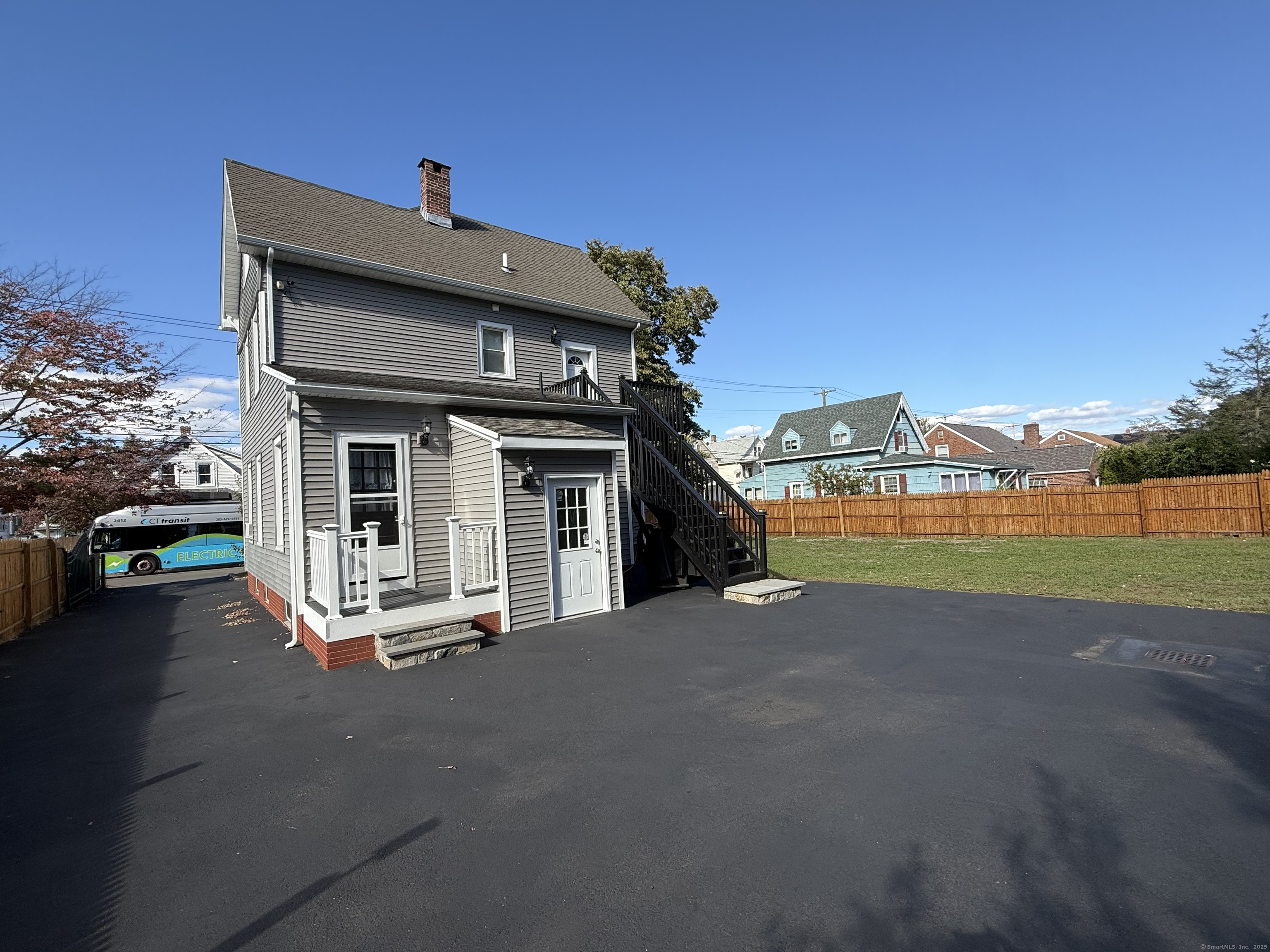 128 Spring Street West Haven, CT 06516 - Photo 3 of 23 a view of a house with a yard