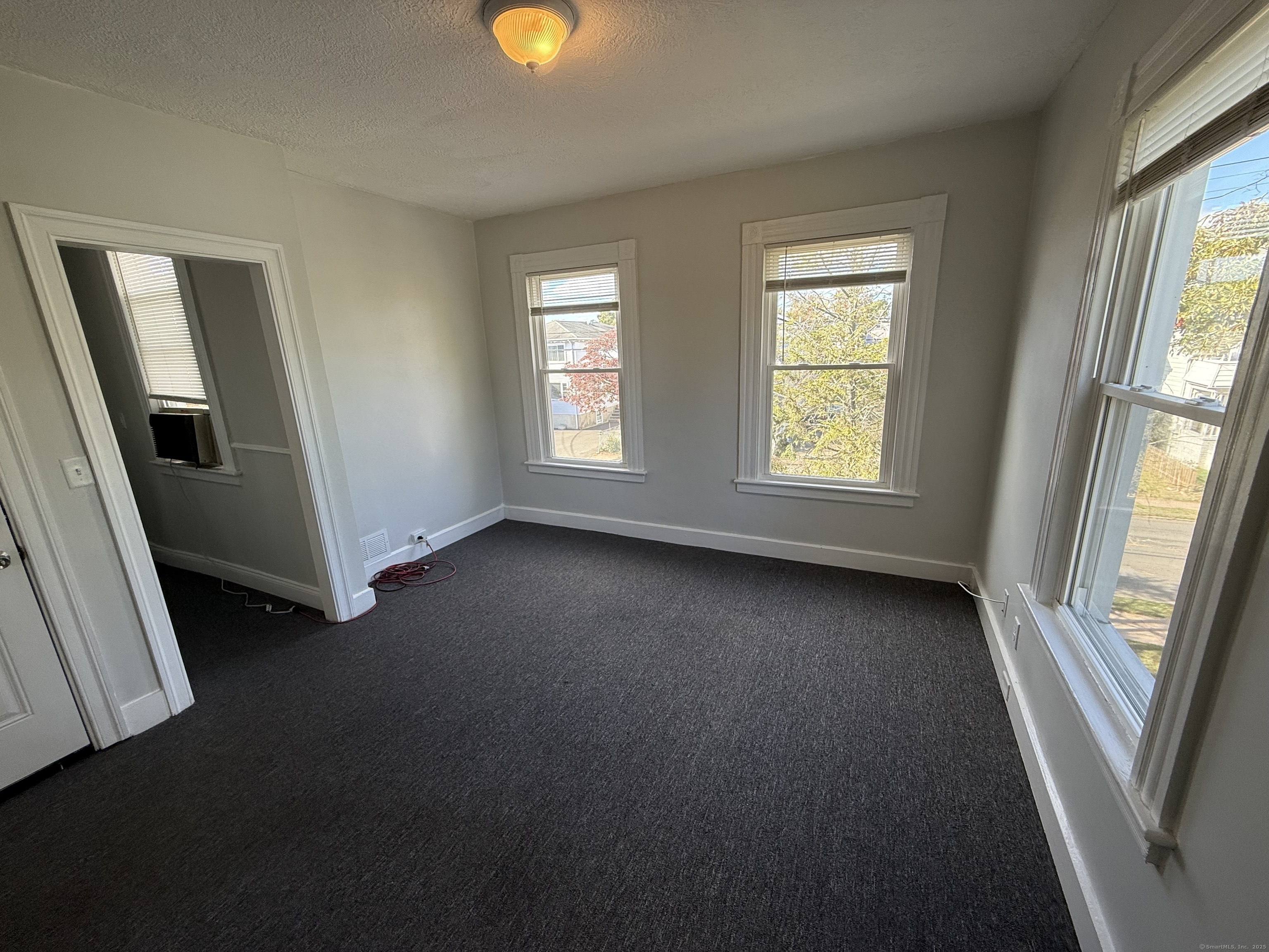 128 Spring Street West Haven, CT 06516 - Photo 8 of 23 a view of a livingroom with a window