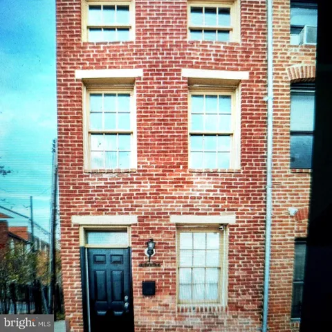 a brick house with a door
