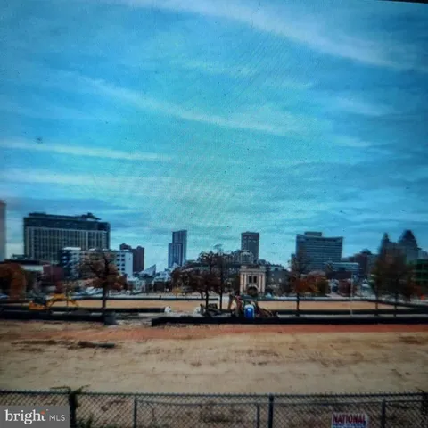 a view of a swimming pool with outdoor seating