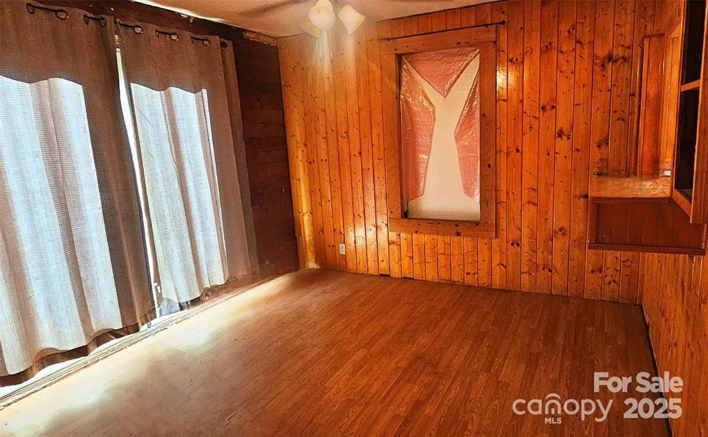 1491 Landrum Road Columbus, NC 28722 - Photo 14 of 15 a view of a room with wooden floor and chair