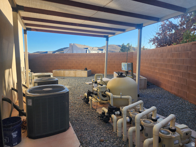 1283 North Gallen Road Santa Clara, UT 84765 - Photo 61 of 103 Fenced backyard with a covered area for pool equipment and garden beds.