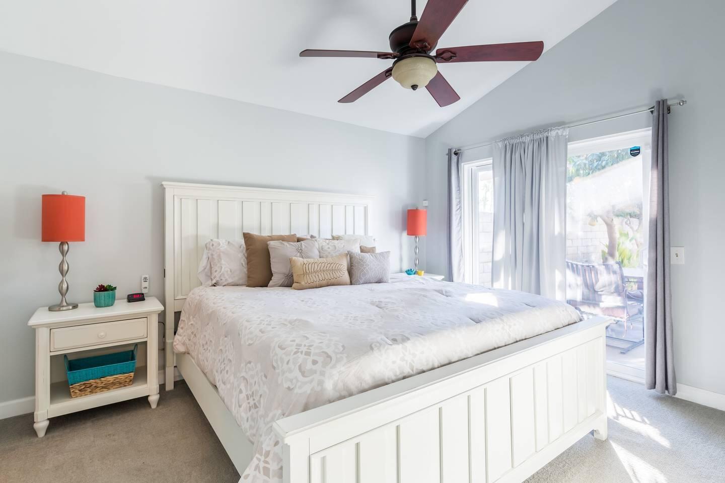 82191 Waring Way Indio, CA 92201 - Photo 13 of 42 a bedroom with a bed and a chandelier