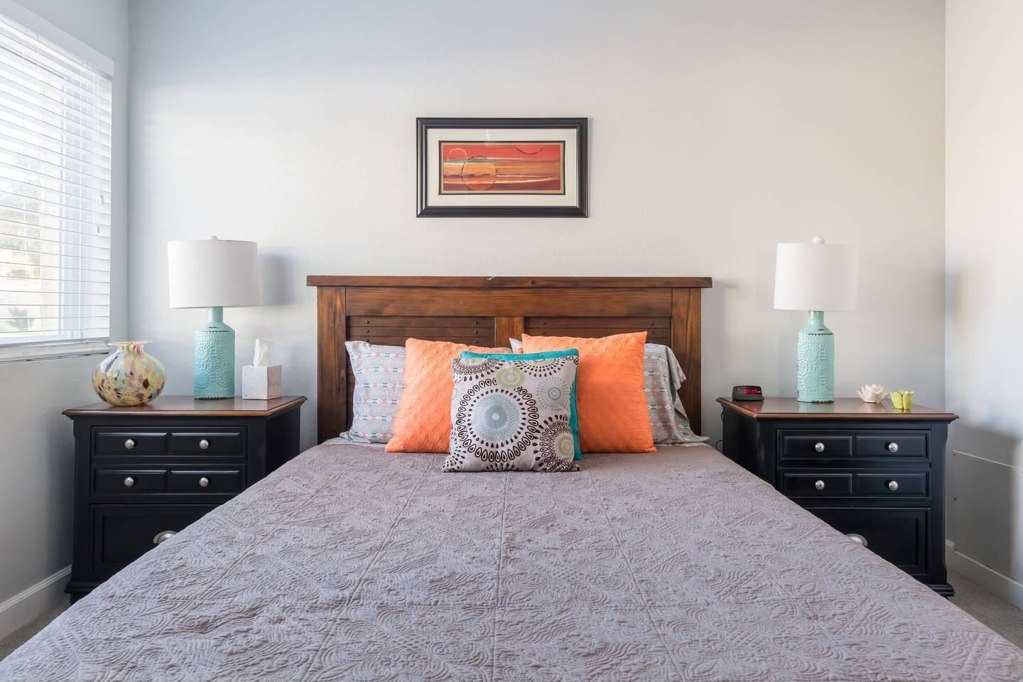 82191 Waring Way Indio, CA 92201 - Photo 15 of 42 a bedroom with a bed and lamp on dresser