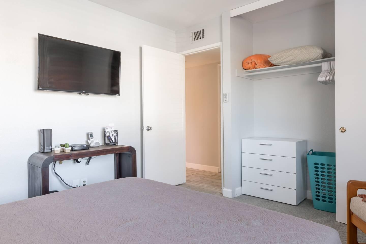 82191 Waring Way Indio, CA 92201 - Photo 19 of 42 a bedroom with a bed and a flat tv screen in it