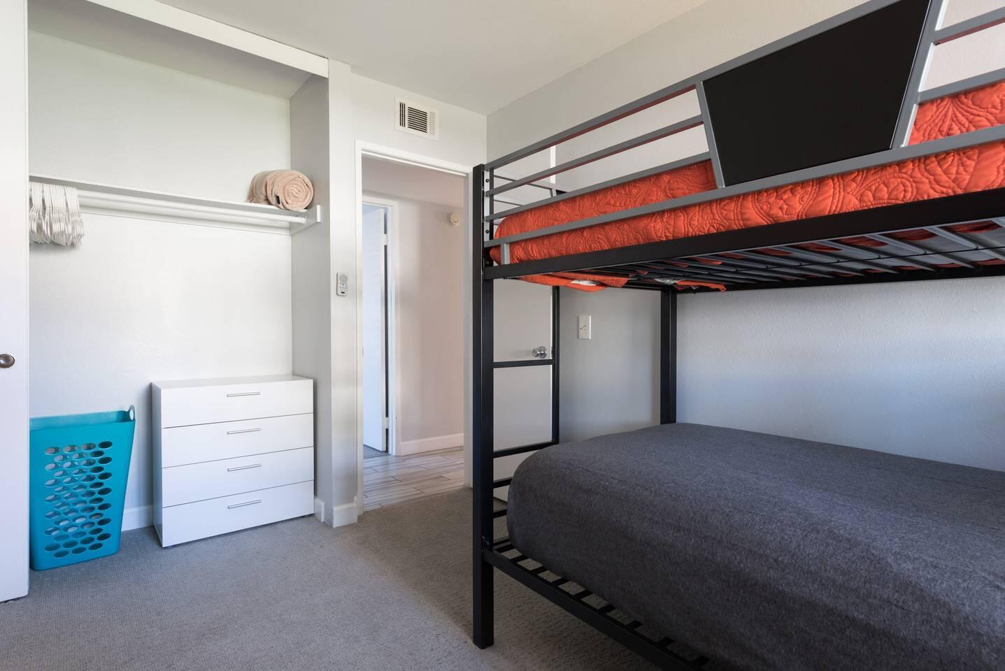 82191 Waring Way Indio, CA 92201 - Photo 27 of 42 a bedroom with a bed and a flat tv screen