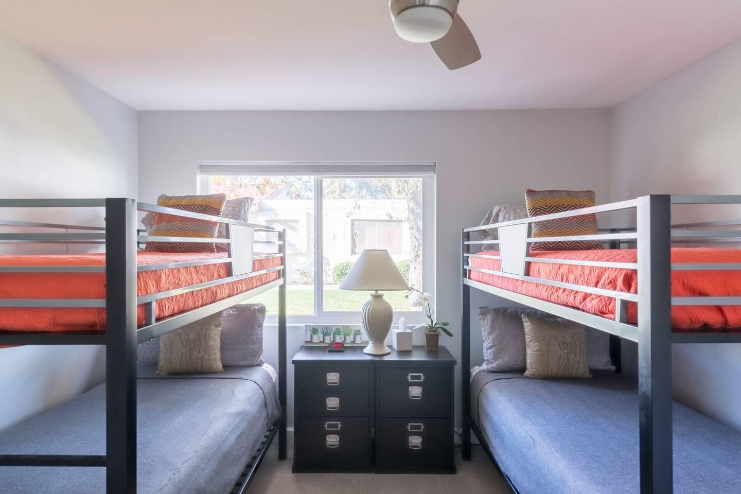 82191 Waring Way Indio, CA 92201 - Photo 28 of 42 a living room with a bed furniture and a window