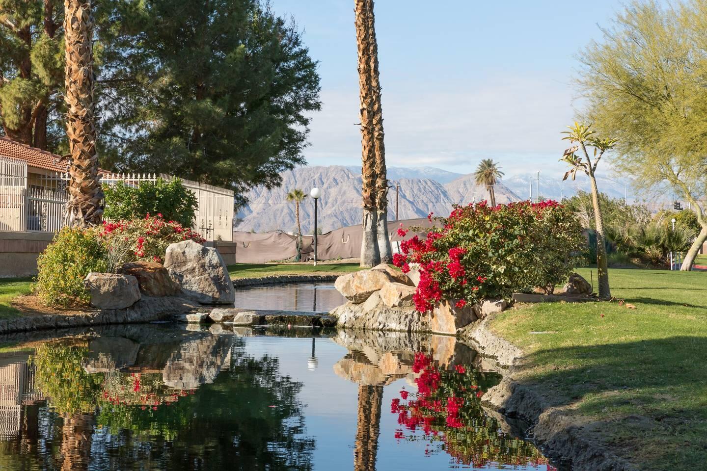 82191 Waring Way Indio, CA 92201 - Photo 29 of 42 a view of a lake with a house in background