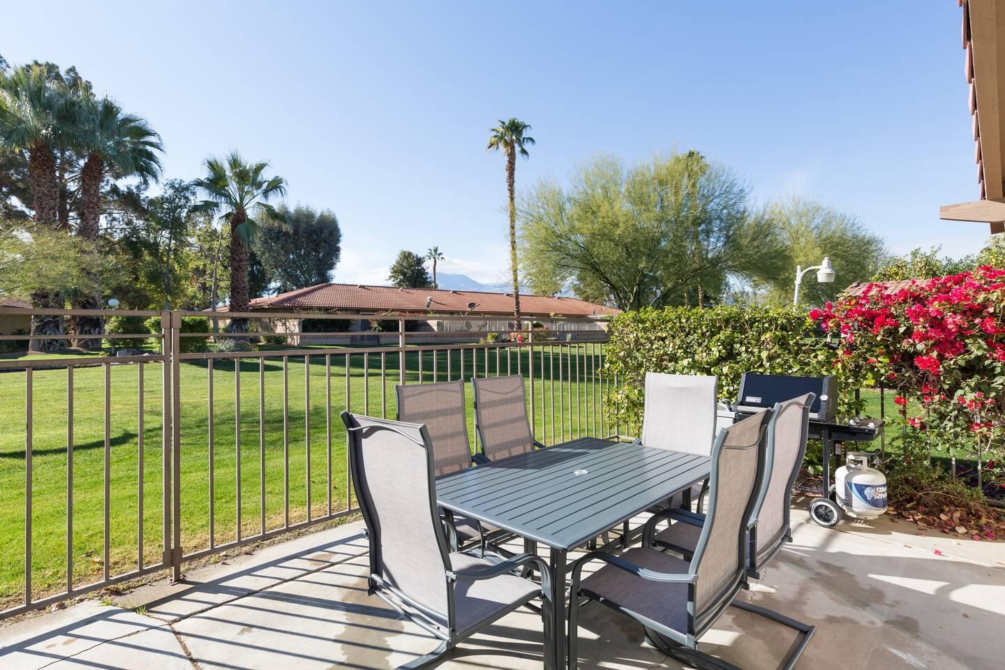 82191 Waring Way Indio, CA 92201 - Photo 30 of 42 a view of a chairs and table in patio with a backyard