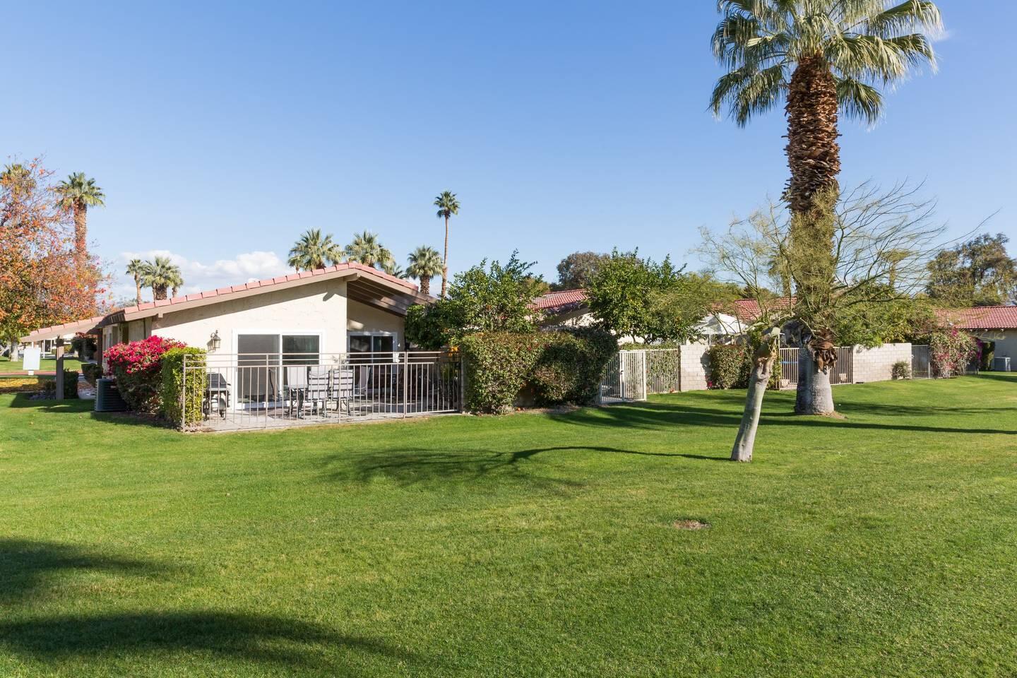 82191 Waring Way Indio, CA 92201 - Photo 34 of 42 a front view of a house with garden
