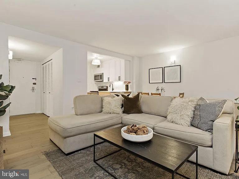 1718 P Street Northwest, Unit T3 Washington, DC 20036 - Photo 1 of 14 a living room with furniture and a wooden floor