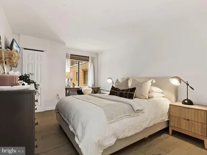 a bedroom with bed and window