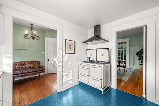 a living room with stainless steel appliances granite countertop furniture and a livingroom view