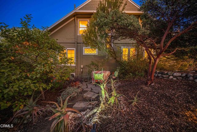 a view of a house with a small yard