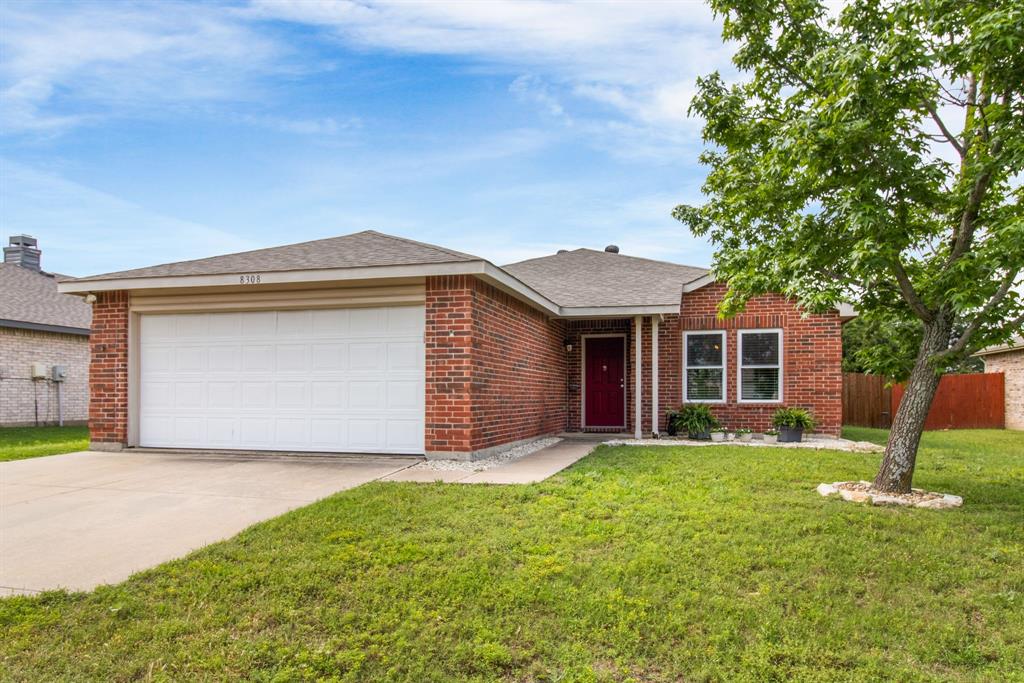 8308 Montecito Drive Denton, TX 76210 - Photo 1 of 1 a front view of house with yard and green space