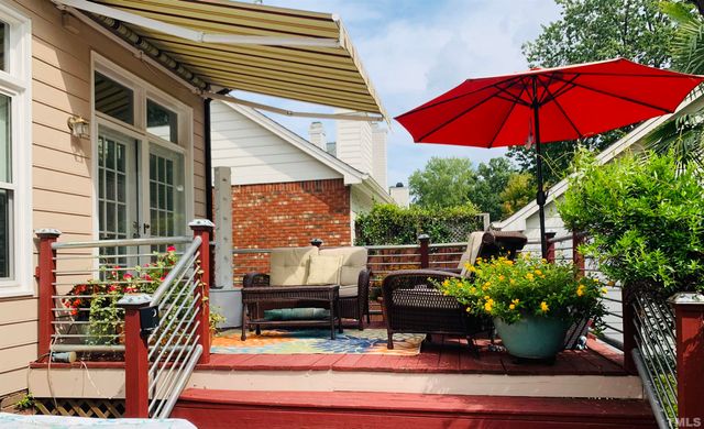a view of a two chairs in the patio
