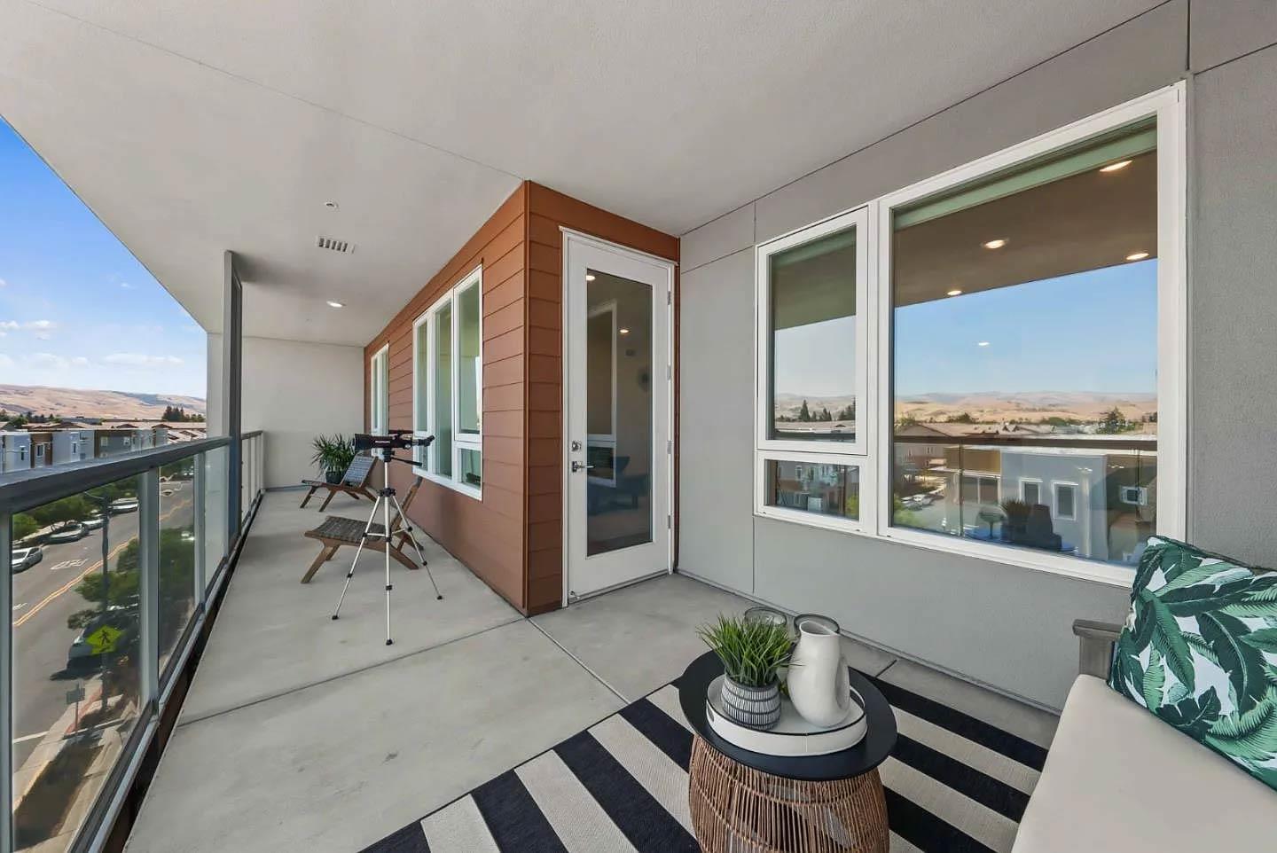 5925 Charlotte Drive, Unit 414 San Jose, CA 95123 - Photo 11 of 18 a view of a living room and a balcony