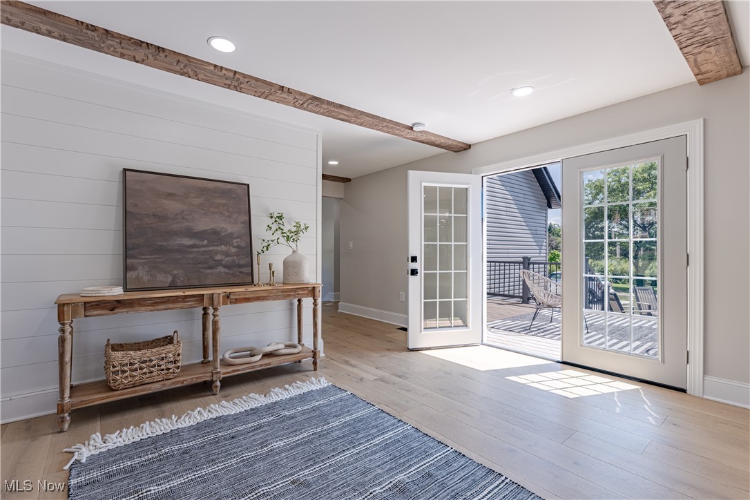 1572 Bell Road Chagrin Falls, OH 44022 - Photo 5 of 36 Doorway to outside featuring beamed ceiling and hardwood / wood-style floors