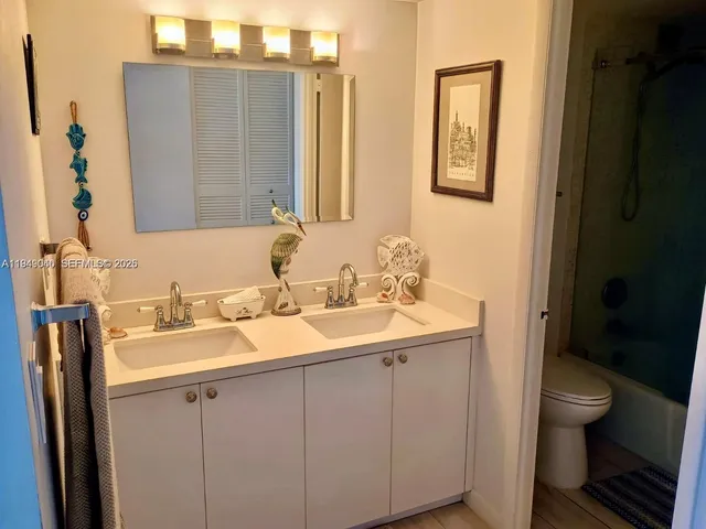 a view of a couches and a table and chairs in patio