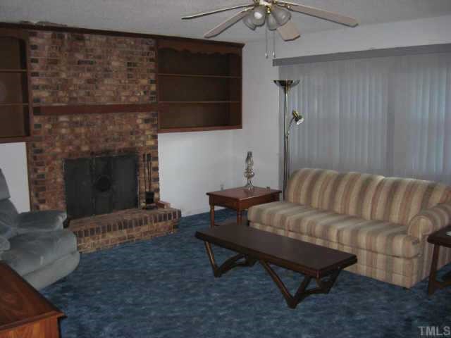 Living room with Fireplace and Bookshelves