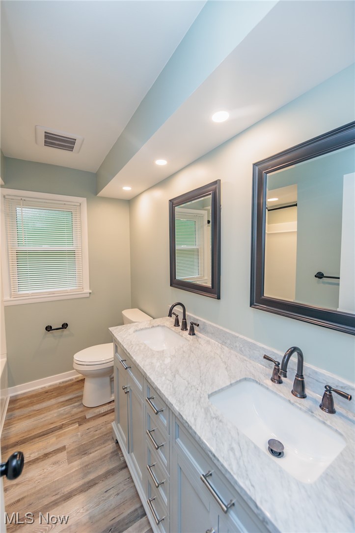 952 Murray Road South Euclid, OH 44121 - Photo 12 of 30 Bathroom with hardwood / wood-style floors, vanity, and toilet