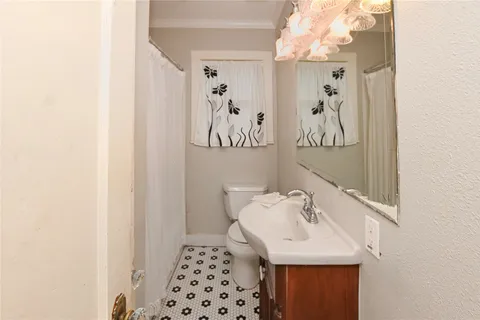 a bathroom with a sink a mirror and a shower