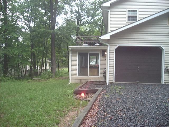 39 Comanche Pines Road Effort, PA 18330 - Photo 13 of 15 Enclosed heated porch with hot tub