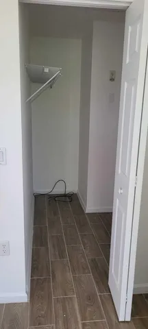 a front view of a house with parking space