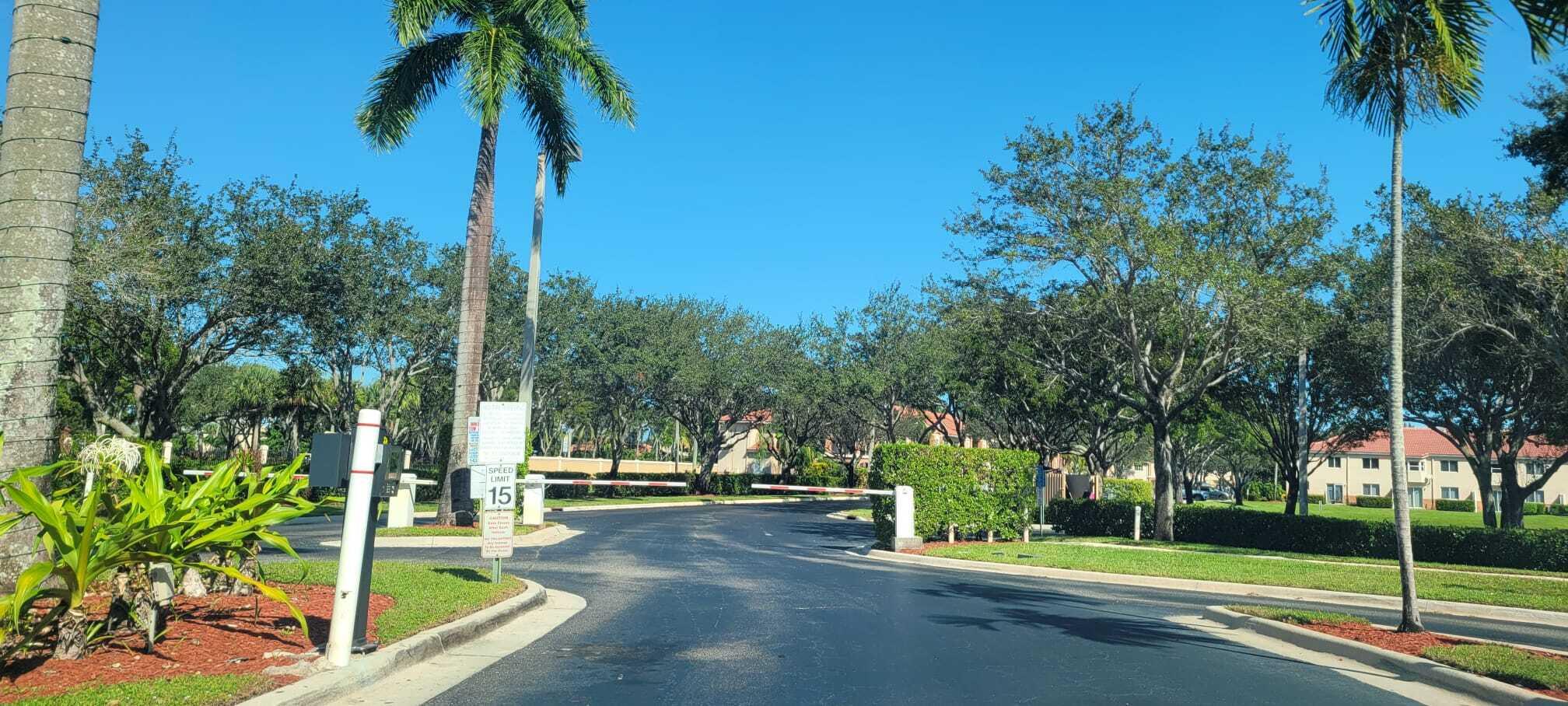 3478 Briar Bay Boulevard, Unit 202 West Palm Beach, FL 33411 - Photo 18 of 23 a view of a park with palm trees