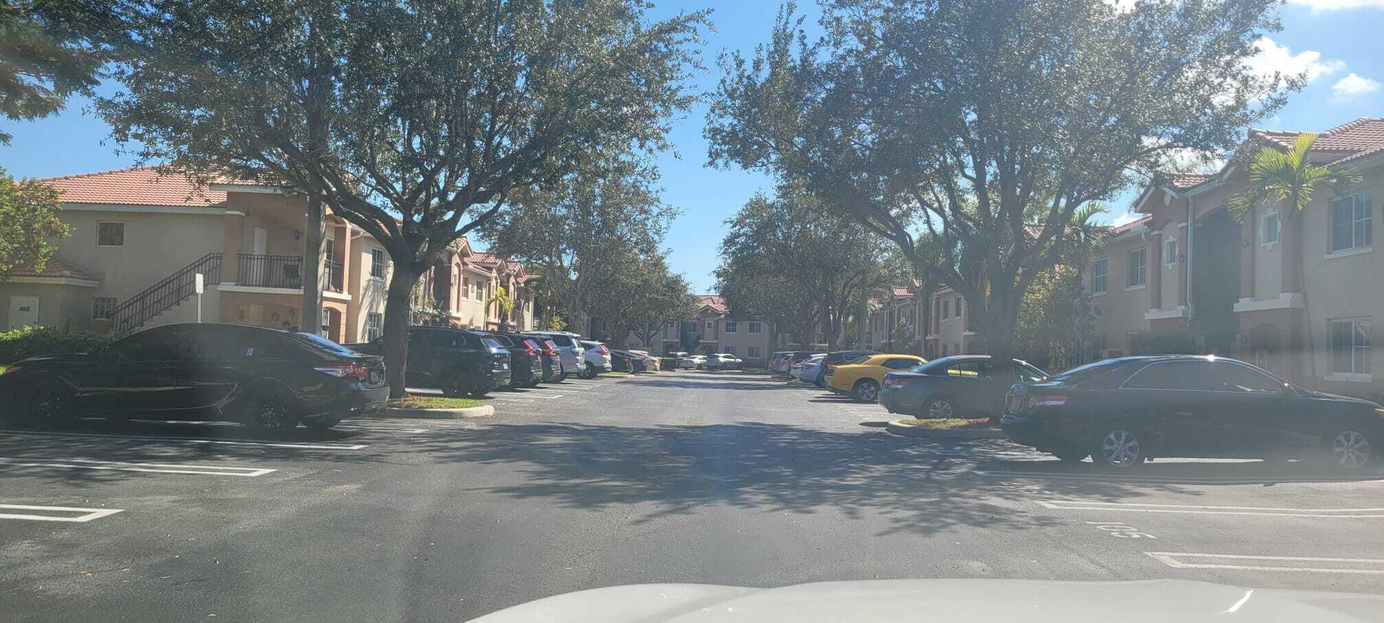 3478 Briar Bay Boulevard, Unit 202 West Palm Beach, FL 33411 - Photo 19 of 23 a view of a outdoor space with trees