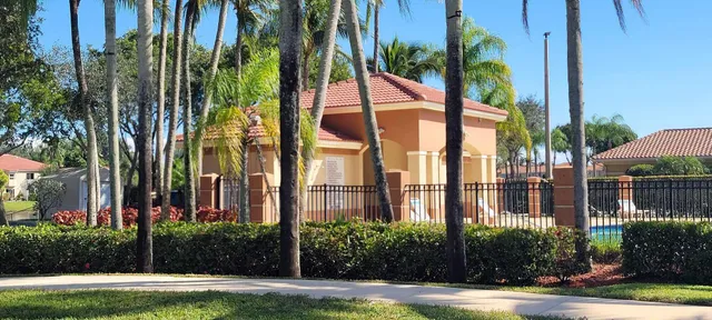 a view of a palm trees in front of a building