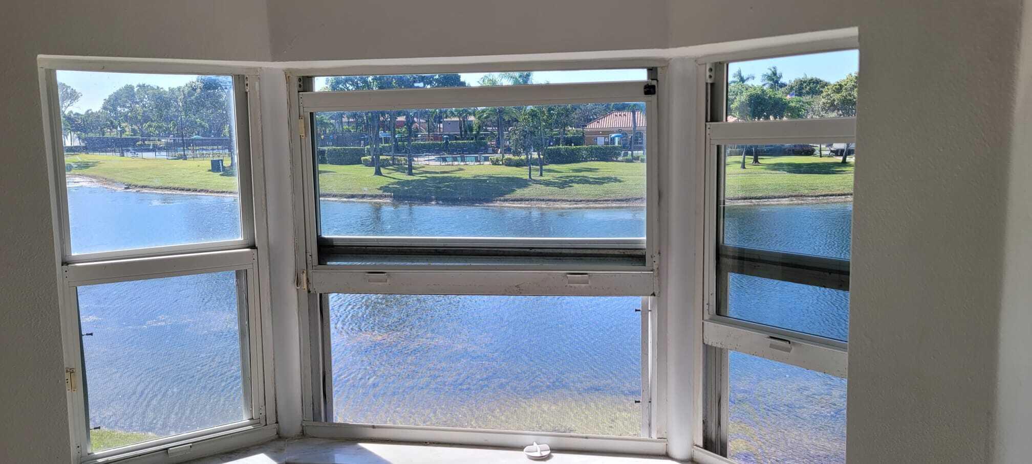 3478 Briar Bay Boulevard, Unit 202 West Palm Beach, FL 33411 - Photo 21 of 23 a view of a glass door with a door