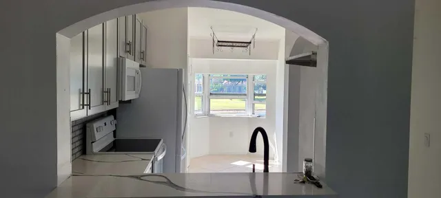 a view of a hallway with entryway