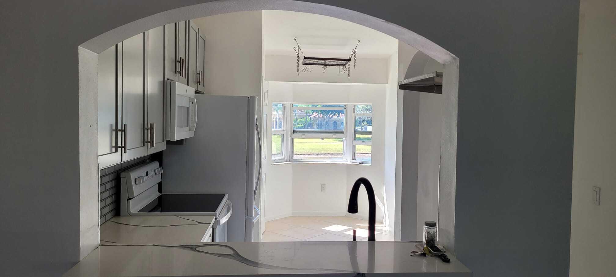 3478 Briar Bay Boulevard, Unit 202 West Palm Beach, FL 33411 - Photo 6 of 23 a view of a hallway with entryway