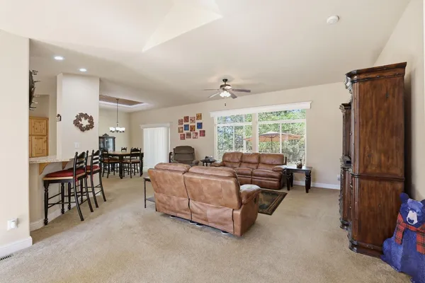 a spacious bedroom with a bed and a chandelier
