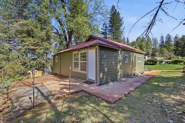 a bathroom with a sink a toilet and shower curtain