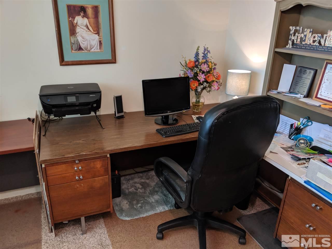 9290 Fremont Way Reno, NV 89506 - Photo 16 of 18 a view of a workspace with furniture and a window