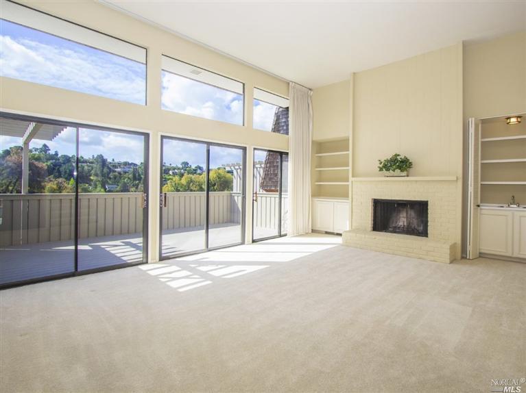 13 Greenside Way San Rafael, CA 94901 - Photo 1 of 1 a view of an empty room with a fireplace and a window