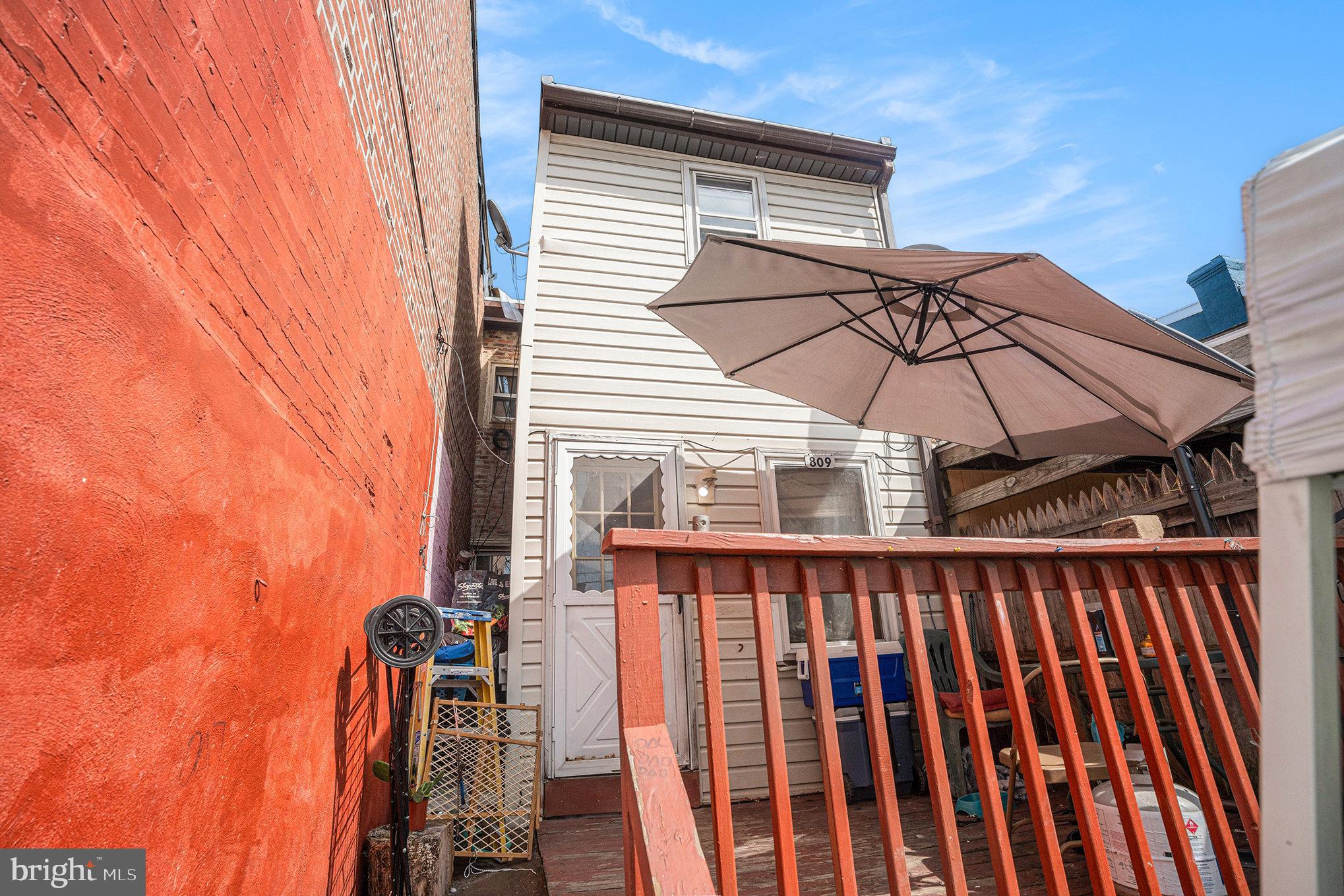 809 George Street Norristown, PA 19401 - Photo 18 of 24 a blue and white umbrella sitting in front of a door