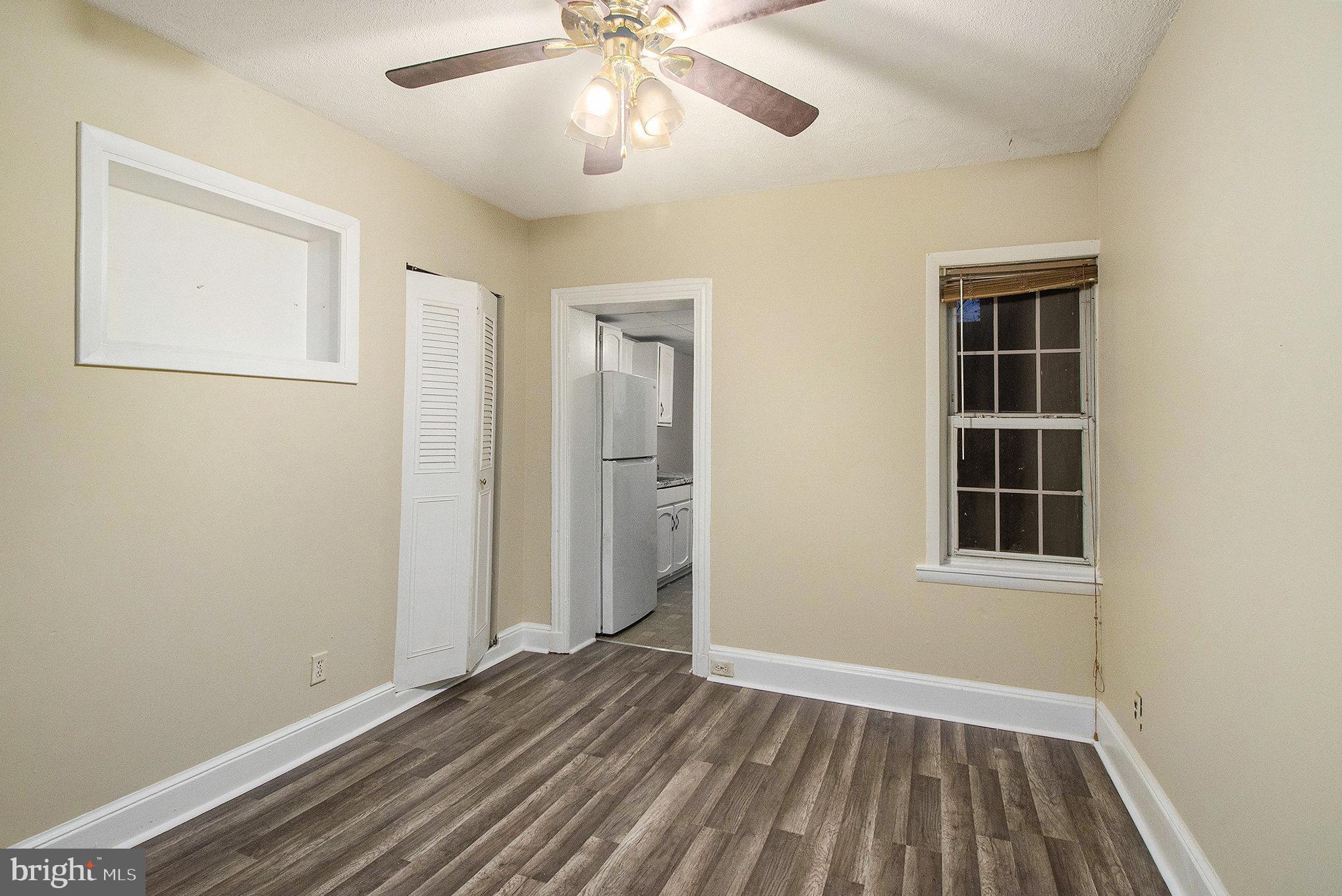 809 George Street Norristown, PA 19401 - Photo 4 of 24 wooden floor in an empty room with a window