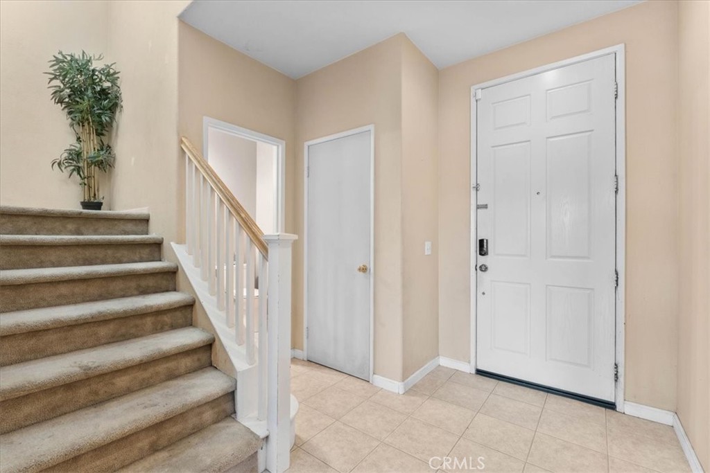 1474 Albillo Loop Perris, CA 92571 - Photo 6 of 35 a view of an entryway with staircase