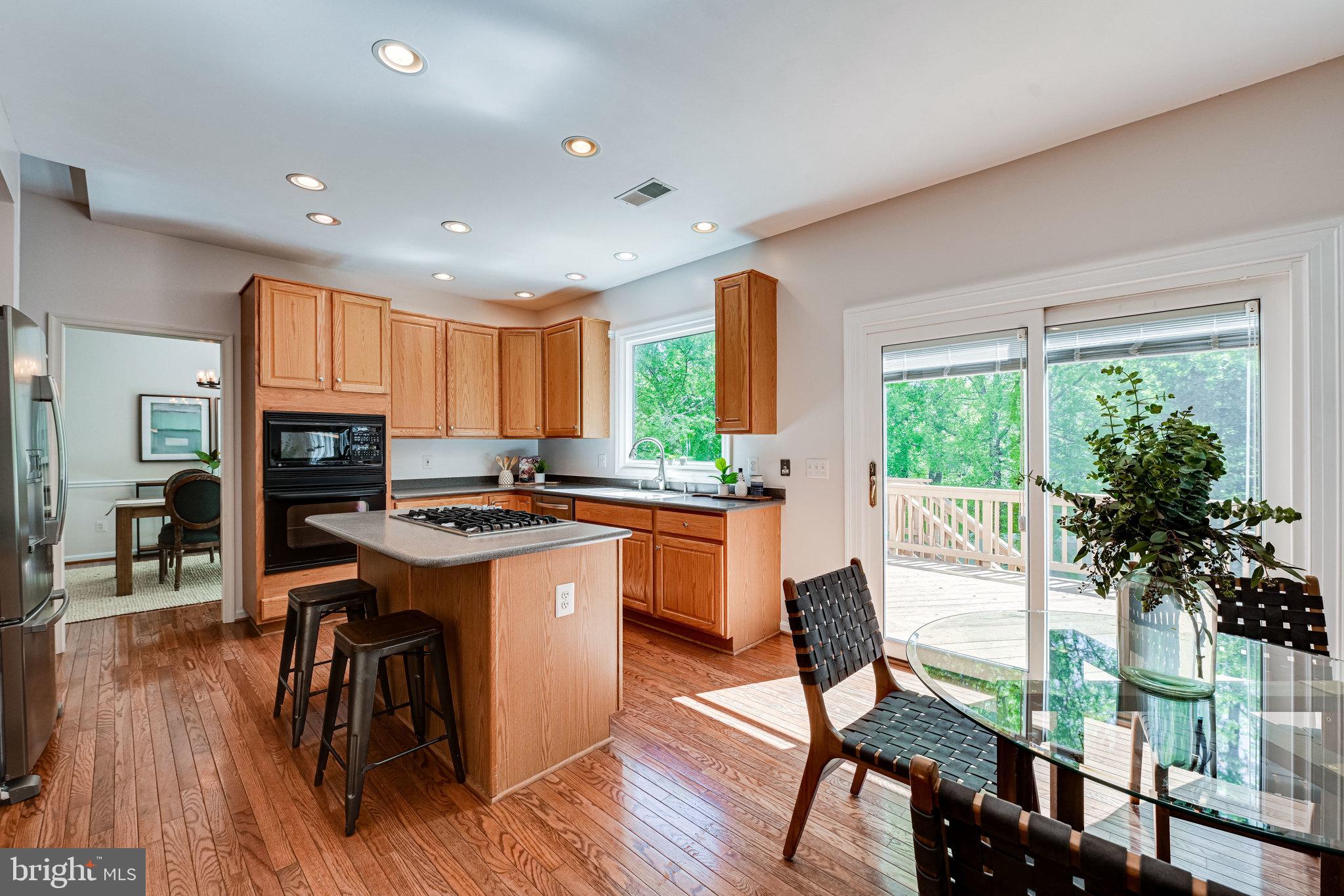 7829 Gambrill Woods Way Springfield, VA 22153 - Photo 16 of 57 Kitchen w/ Sliding Doors to Deck
