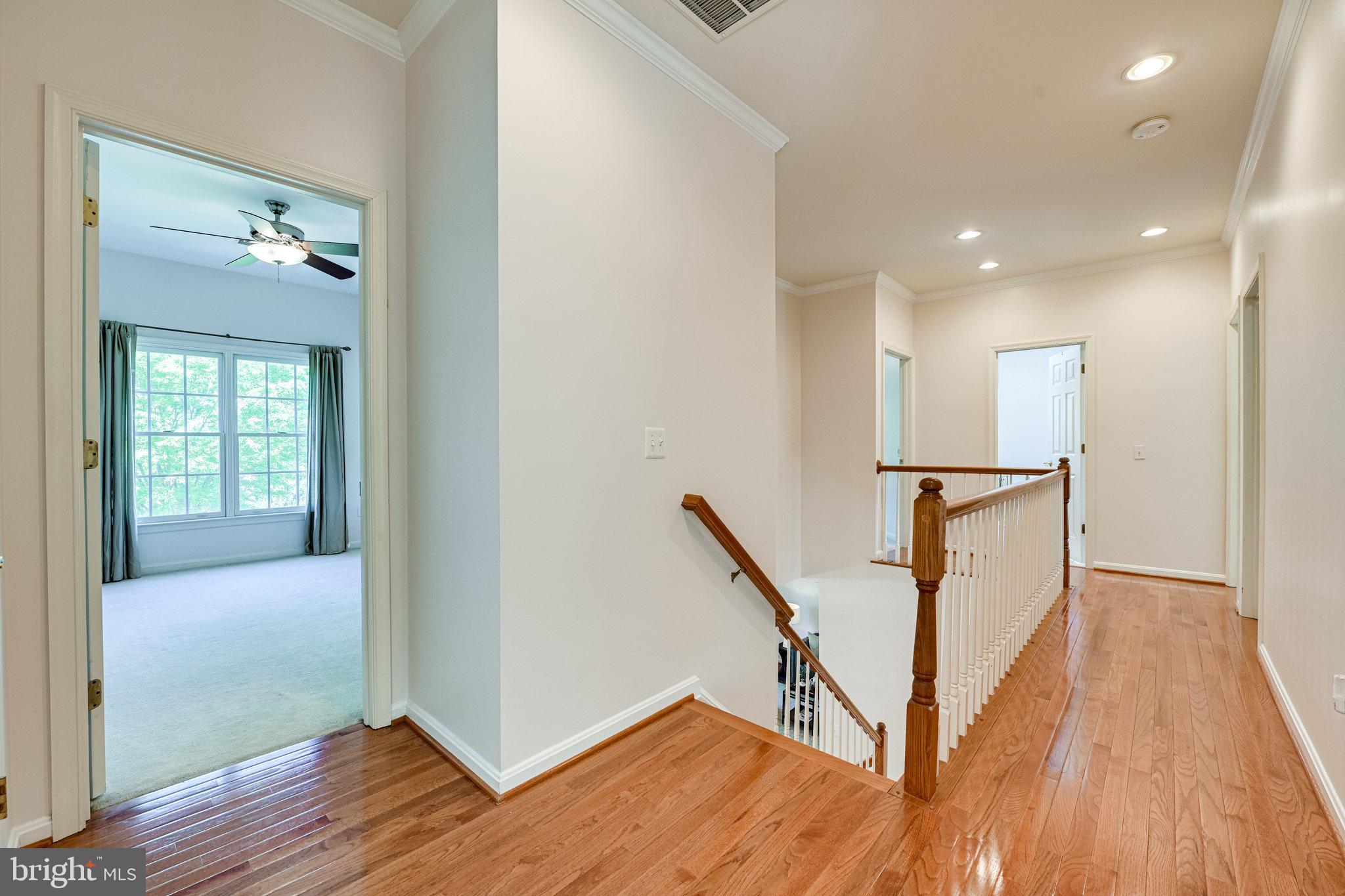 7829 Gambrill Woods Way Springfield, VA 22153 - Photo 26 of 57 Upper level hallway w/ Hardwood Floors