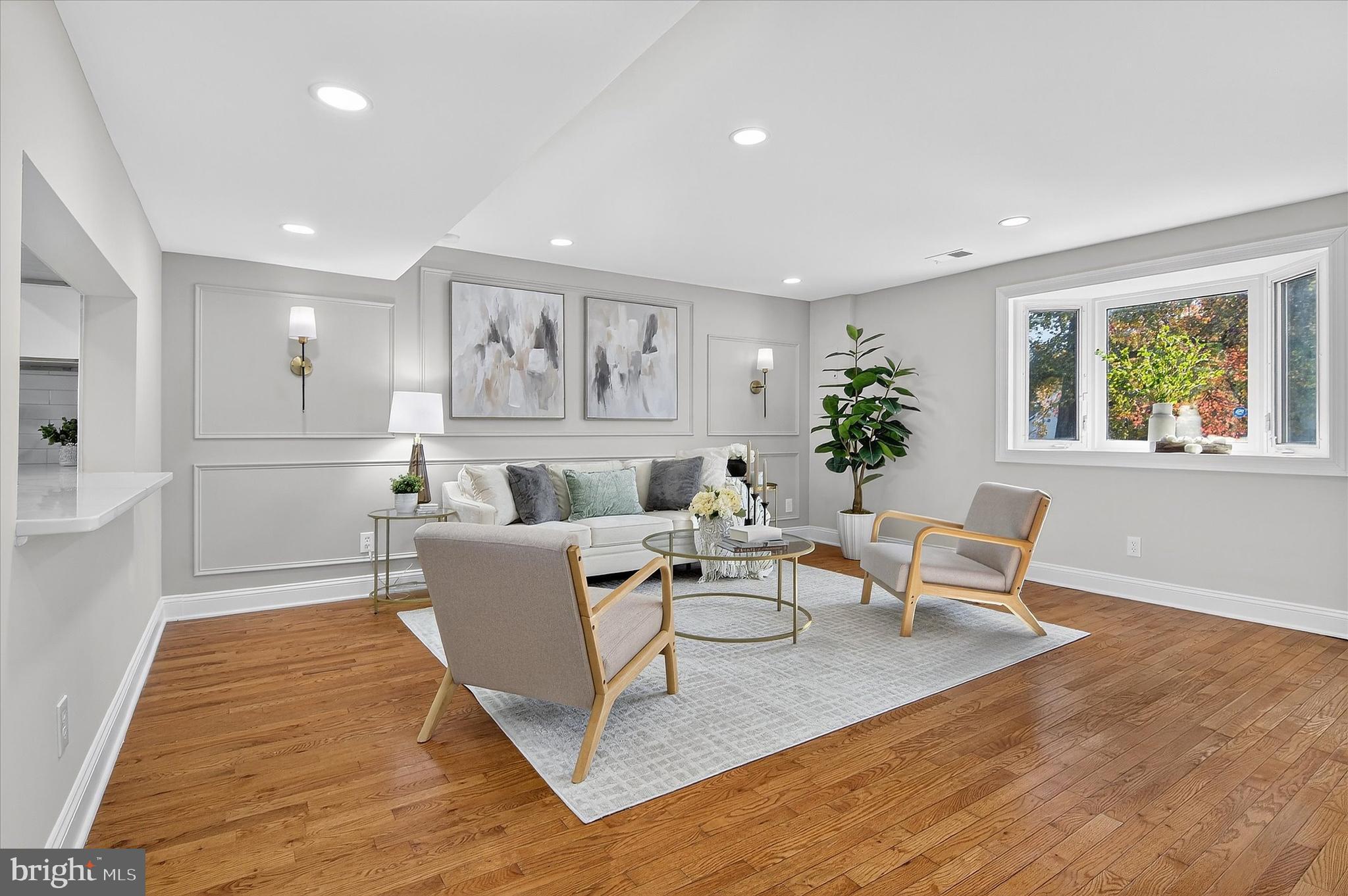 3681 Masthead Trail Triangle, VA 22172 - Photo 11 of 40 a living room with furniture and a large window