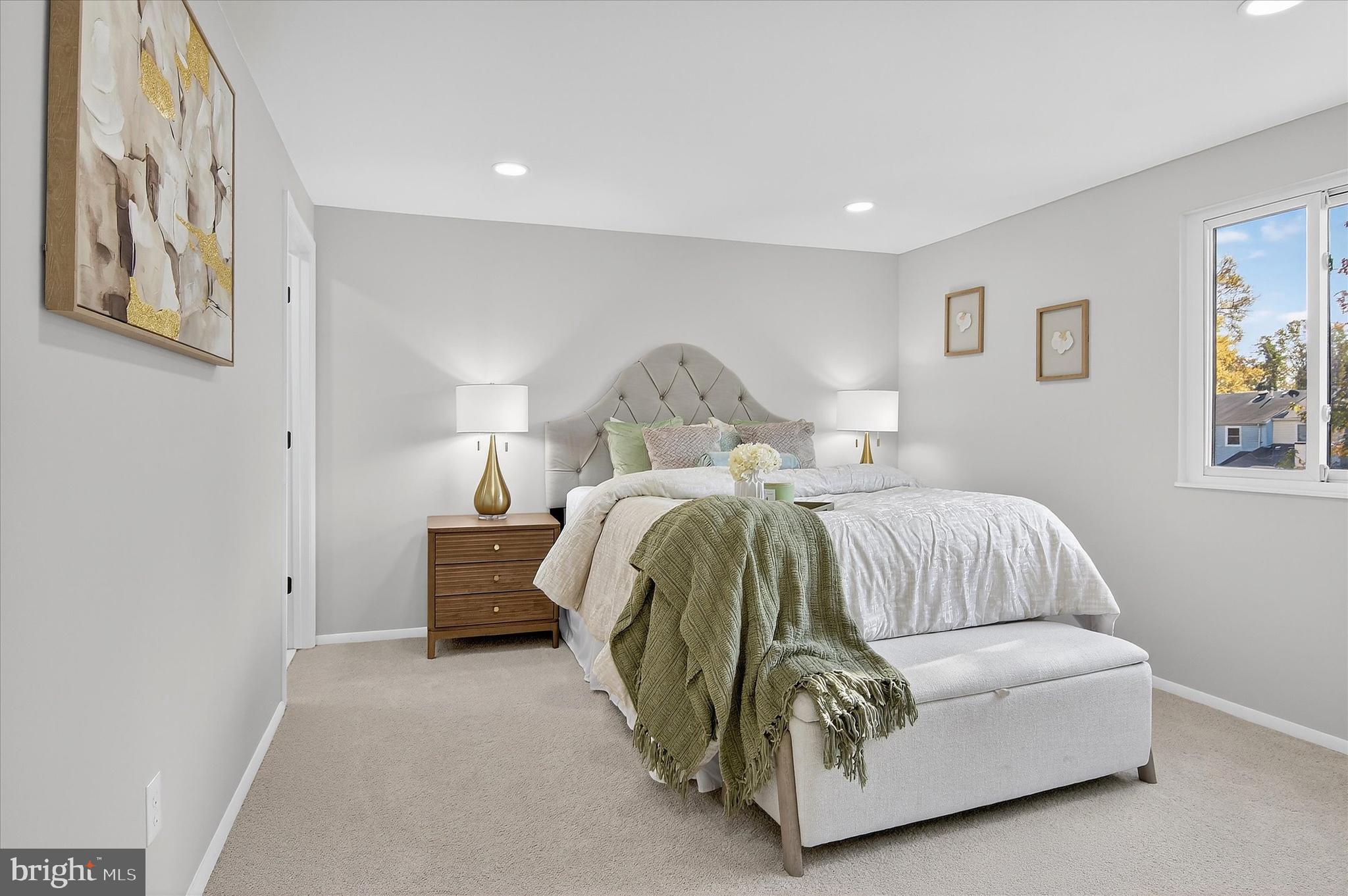 3681 Masthead Trail Triangle, VA 22172 - Photo 18 of 40 a bedroom with a bed and painting on the wall