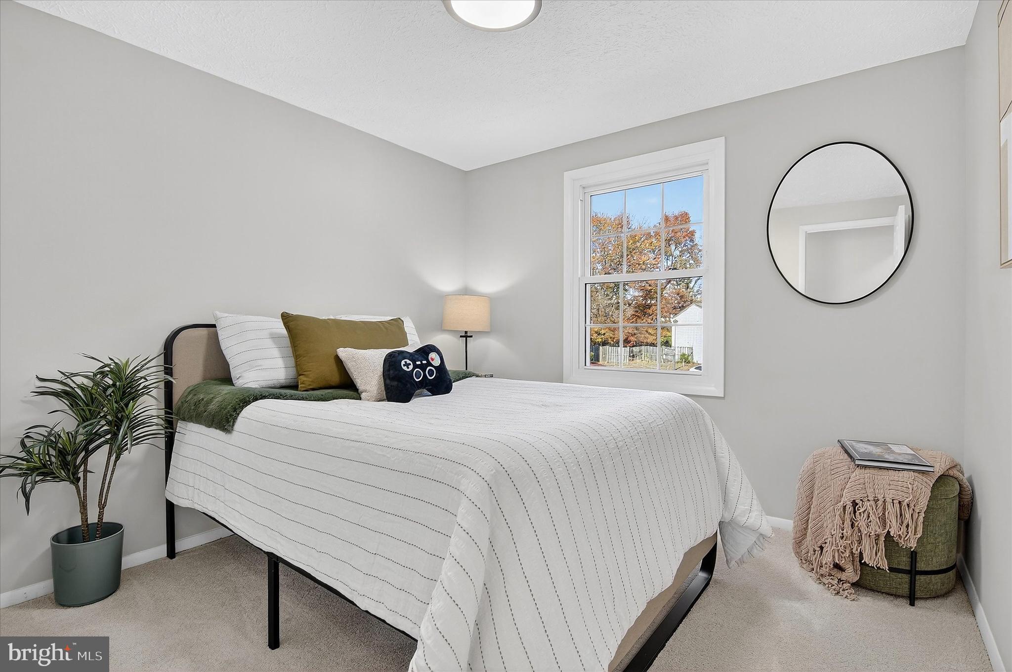 3681 Masthead Trail Triangle, VA 22172 - Photo 26 of 40 a bedroom with a bed and window