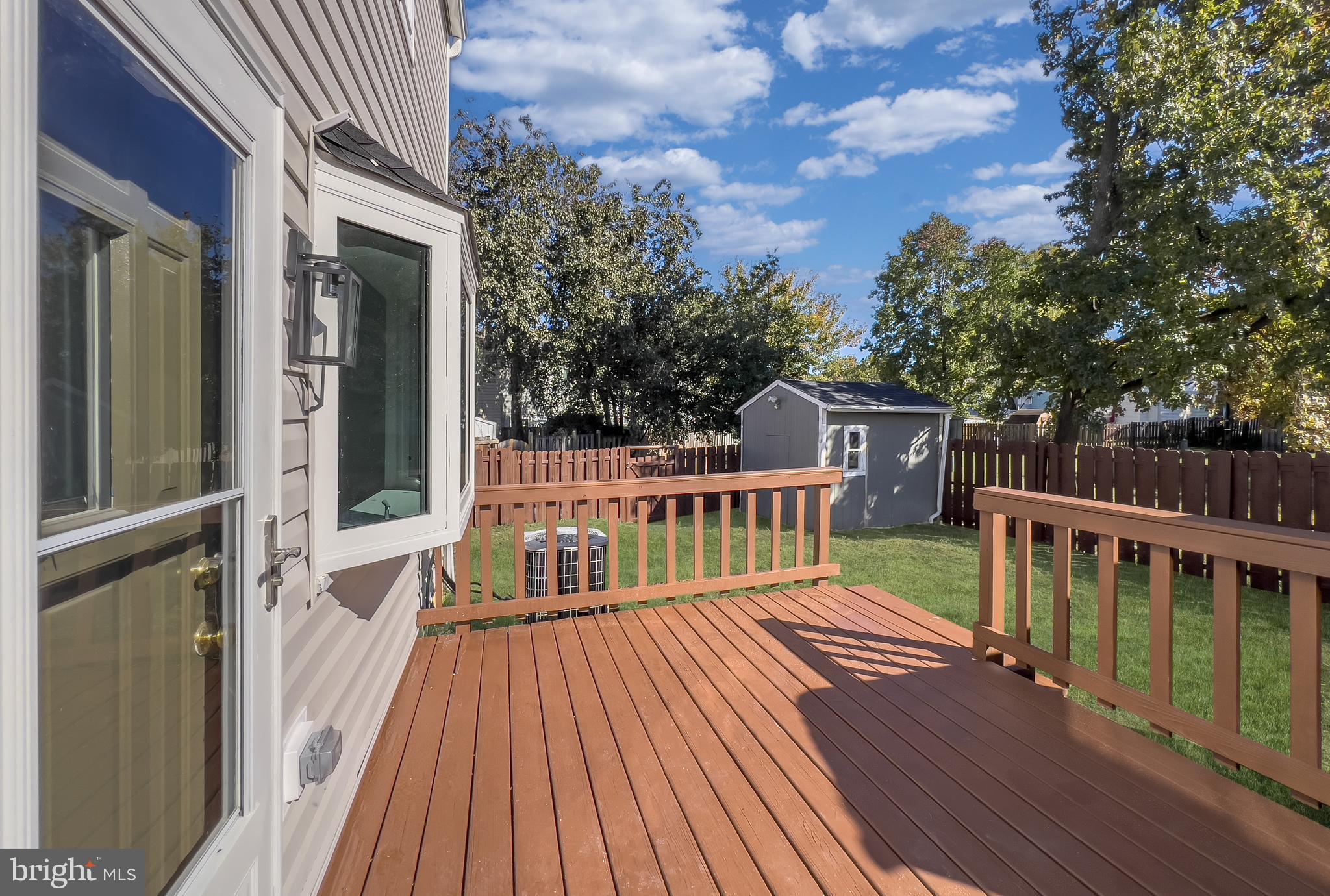 3681 Masthead Trail Triangle, VA 22172 - Photo 33 of 40 a view of balcony with deck and wooden floor